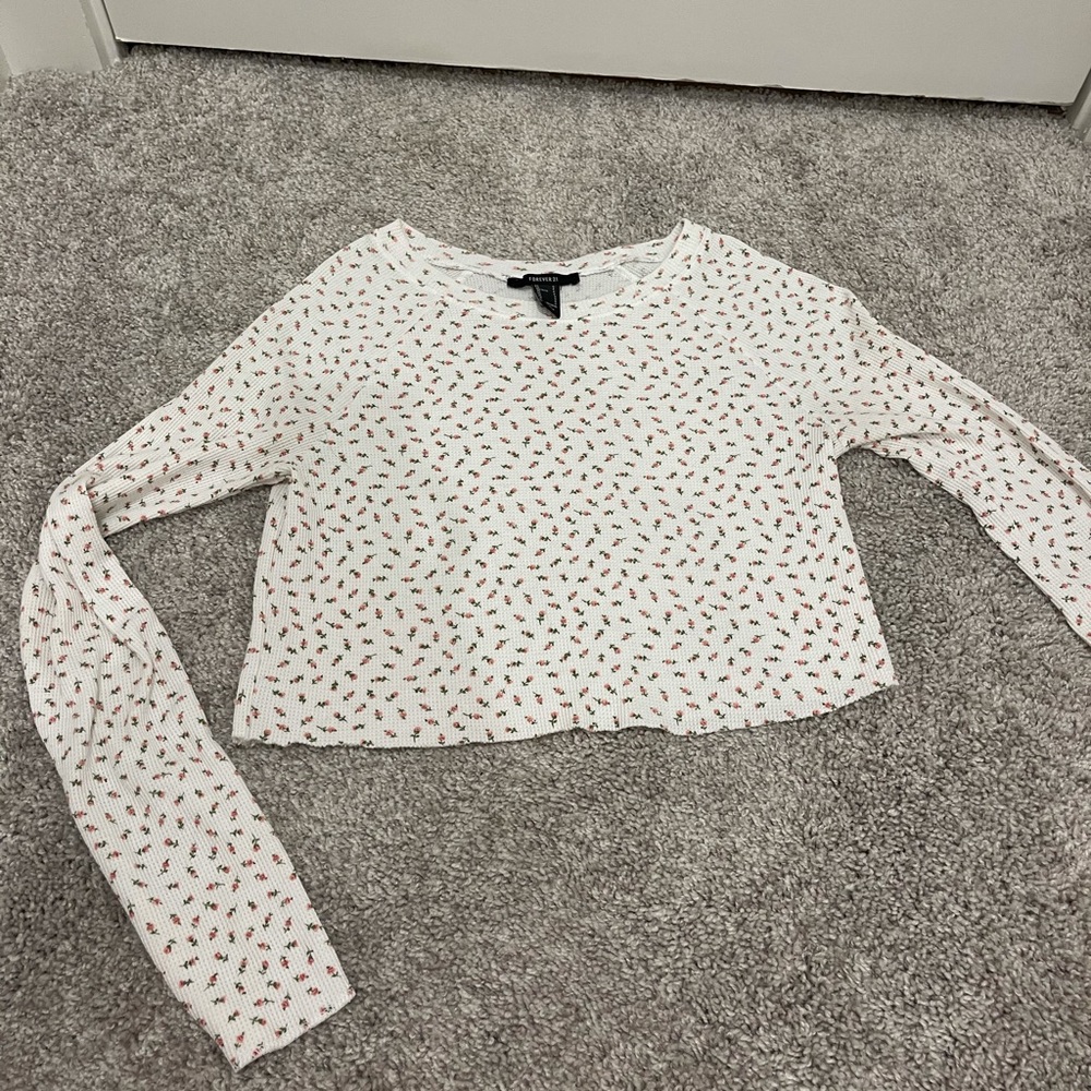 White top with pink and green flowers